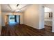 Open-concept living area with wood-look flooring and a view of the kitchen, perfect for entertaining at 681 Greywood Dr, Altamonte Springs, FL 32701