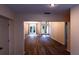 Spacious living area with wood-look floors, light paint and natural light, ideal for gatherings at 681 Greywood Dr, Altamonte Springs, FL 32701