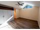 This main bedroom features wood floors, plenty of closet space, and a modern ceiling fan at 681 Greywood Dr, Altamonte Springs, FL 32701