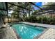 A refreshing screened-in private pool is surrounded by lush landscaping, offering a tranquil outdoor retreat at 681 Greywood Dr, Altamonte Springs, FL 32701
