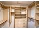 Spacious walk-in closet with custom built-in shelves, drawers, and gold-colored hardware at 681 Greywood Dr, Altamonte Springs, FL 32701