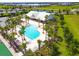 Community pool features palm trees and lounge chairs for relaxing poolside at 8128 Penrose Pl, Wildwood, FL 34785