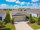 Attractive single-story home displays a paved driveway and a well-kept front lawn at 8128 Penrose Pl, Wildwood, FL 34785
