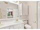 Bathroom with double sinks, updated fixtures, and shower/tub combo at 9223 Silver Lake Dr, Leesburg, FL 34788