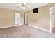 Bedroom featuring carpet floors, and doors to the bathroom and closet at 9223 Silver Lake Dr, Leesburg, FL 34788
