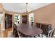 Formal dining room featuring a large table, elegant chandelier, and classic decor for sophisticated dining experiences at 9223 Silver Lake Dr, Leesburg, FL 34788