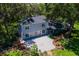 Charming home featuring a spacious patio, manicured garden, and new windows at 9223 Silver Lake Dr, Leesburg, FL 34788