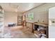 Spacious garage with workbench area, window and concrete floors providing ample workspace at 9223 Silver Lake Dr, Leesburg, FL 34788