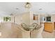 Spacious great room with tile floors and a breakfast nook with large windows at 9223 Silver Lake Dr, Leesburg, FL 34788