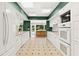 Spacious kitchen with white cabinets, updated appliances and backyard view at 9223 Silver Lake Dr, Leesburg, FL 34788