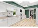 Bright kitchen featuring white cabinets, modern appliances, and tiled backsplash at 9223 Silver Lake Dr, Leesburg, FL 34788