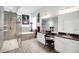 Bright bathroom features a glass shower, soaking tub, double vanity with granite countertops and stylish decor at 9702 Pepper Tree Pl, Wildwood, FL 34785