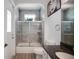 Updated bathroom with tiled shower and tub, white vanity, and granite countertop at 9702 Pepper Tree Pl, Wildwood, FL 34785