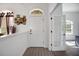 Welcoming entryway with a front door and adjacent home office at 9702 Pepper Tree Pl, Wildwood, FL 34785