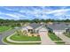 Charming single-story home boasts lush landscaping, well-manicured lawn, and a two-car garage at 9702 Pepper Tree Pl, Wildwood, FL 34785