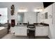Well-lit main bathroom with double sinks, a soaking tub, a separate shower, and modern fixtures at 9702 Pepper Tree Pl, Wildwood, FL 34785