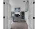 Bright office space with French doors, gray desk, and comfortable seating at 9702 Pepper Tree Pl, Wildwood, FL 34785