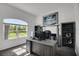 Cozy home office with a window, desk and shelving at 9702 Pepper Tree Pl, Wildwood, FL 34785