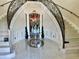 Elegant foyer showcasing a grand staircase with ornate iron railings at 10301 Savannah Ridge Ln, Winter Garden, FL 34787