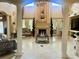 Opulent living room with high ceilings, decorative columns, and elegant furnishings at 10301 Savannah Ridge Ln, Winter Garden, FL 34787