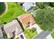Overhead shot showcasing roof, landscaping, driveway and surrounding neighborhood at 1032 Ventura Dr, Lady Lake, FL 32159