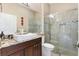 Bathroom with granite countertops, modern vessel sink and walk-in shower at 1032 Ventura Dr, Lady Lake, FL 32159