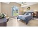 Bedroom with light-filled window and a view of the front yard at 1032 Ventura Dr, Lady Lake, FL 32159