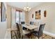 Elegant dining room with a marble-top table, stylish chairs, and decorative wall art at 1032 Ventura Dr, Lady Lake, FL 32159