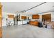 Spacious garage features washer and dryer, wash sink, cabinets and storage at 1032 Ventura Dr, Lady Lake, FL 32159
