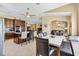 Open-concept layout featuring a kitchen with an island bar and a dining area for entertaining at 1032 Ventura Dr, Lady Lake, FL 32159