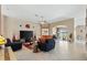 Bright and airy living room with tile flooring, modern decor, and an open floor plan at 1032 Ventura Dr, Lady Lake, FL 32159
