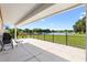 Covered patio with views of the lake at 1032 Ventura Dr, Lady Lake, FL 32159