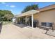 Covered patio featuring sliding glass doors, neutral color scheme, and comfortable seating arrangements at 1032 Ventura Dr, Lady Lake, FL 32159