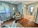 Charming bedroom with a view to the bathroom and vanity, a relaxing chair and a comfortable vibe at 113 Temple W Cv, Leesburg, FL 34748