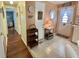 Traditional-style kitchen with white appliances, tile flooring and decorative elements in a well-lit space at 113 Temple W Cv, Leesburg, FL 34748