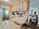 A well-lit kitchen with modern appliances is perfect for cooking and entertaining, boasting both functionality and charm at 113 Temple W Cv, Leesburg, FL 34748