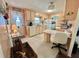 Cozy kitchen with cream-colored cabinetry and a functional layout at 113 Temple W Cv, Leesburg, FL 34748