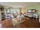 Comfortable living room with plenty of seating, stylish décor, and natural light, offering a welcoming space for relaxation at 113 Temple W Cv, Leesburg, FL 34748