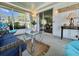 Cozy screened-in porch with comfortable seating and relaxing atmosphere at 113 Temple W Cv, Leesburg, FL 34748