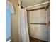 Updated shower features modern tile with decorative border and grab bar at 113 Temple W Cv, Leesburg, FL 34748