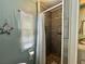 Shower with gray tile at 113 Temple W Cv, Leesburg, FL 34748