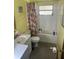 Clean and functional bathroom with a tub and shower combination and retro fixtures at 11651 Fairmont Ave, Leesburg, FL 34788