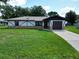 Charming single-story home with a well-manicured lawn and inviting curb appeal at 11681 Se 72Nd Court Rd, Belleview, FL 34420