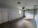Clean garage featuring white walls, and a functional garage door at 11681 Se 72Nd Court Rd, Belleview, FL 34420