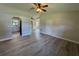 Bright living room showcasing an open floor plan with views to the kitchen at 11681 Se 72Nd Court Rd, Belleview, FL 34420
