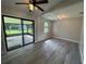 Open-concept floor plan with sliding glass doors that leads to a screened patio at 11681 Se 72Nd Court Rd, Belleview, FL 34420