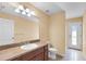 Bathroom featuring a vanity with dark wood cabinets at 12407 Ne 48Th Loop, Oxford, FL 34484