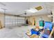Garage featuring white doors, storage opportunities, and concrete flooring at 12407 Ne 48Th Loop, Oxford, FL 34484
