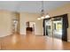 Spacious living room with wood floors featuring an open layout and views to other rooms at 12407 Ne 48Th Loop, Oxford, FL 34484