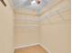 Walk-in closet featuring wire shelving and a ceiling fan at 12407 Ne 48Th Loop, Oxford, FL 34484